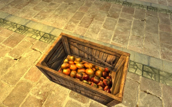 Caisse de pommes et d’oranges presque vide